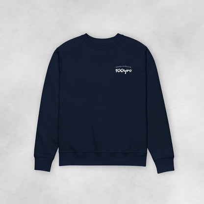 The front view of a navy coloured 100% organic cotton sweatshirt with the sleeves spread to the side.
