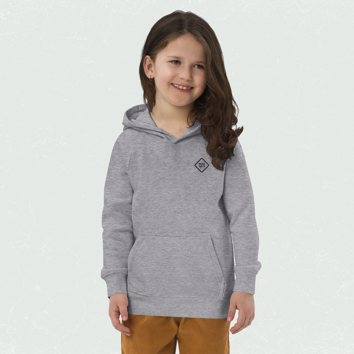 Unisex Kids Eco Hoodie in grey with "100yrs" logo, worn by smiling child.