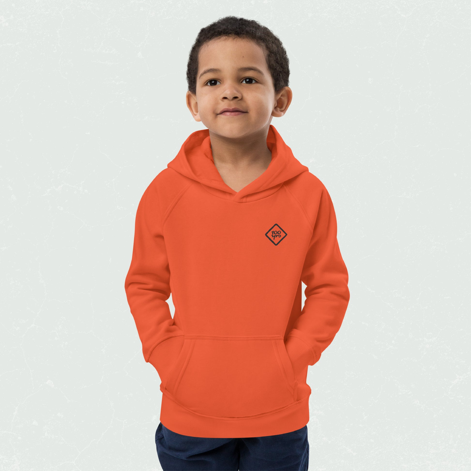 Unisex Kids Eco Hoodie with 100yrs Logo in vibrant orange, featuring front pouch pocket, and cozy jersey-lined hood.